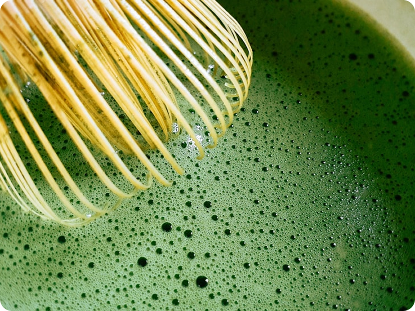 Toronto-sourced matcha being whisked into a smooth green froth